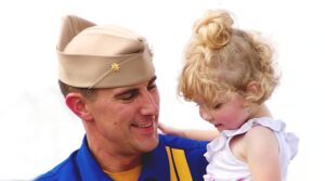 Lieutenant Commander John Hiltz greets a young fan after the US Navy Blue Angels perform at the Vectren Dayton Air Show in Dayton, Ohio, on Saturday, June 28, 2014. (Andrea Nay)